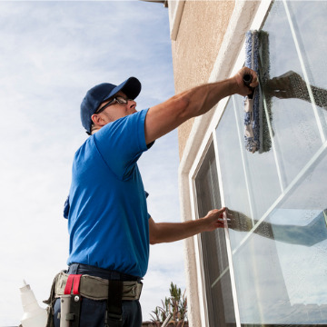 Professional cleaners washing windows during Post Construction Cleaning in Peoria IL