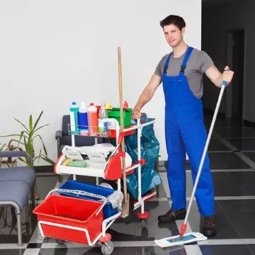 A professional cleaner is seen with equipment. If you're asking, "Why is Cleaning Helpful for Healthcare?" call Corporate Clean.