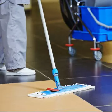 A worker is seen cleaning a floor. Corporate Clean is the favorite of commercial cleaning companies in Peoria IL.