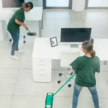 Professional cleaners are seen at work. Corporate Clean offers Business Cleaning in East Peoria IL.