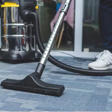 A cleaner is seen cleaning an office floor. The best office cleaning in central Illinois is done by Corporate Clean.